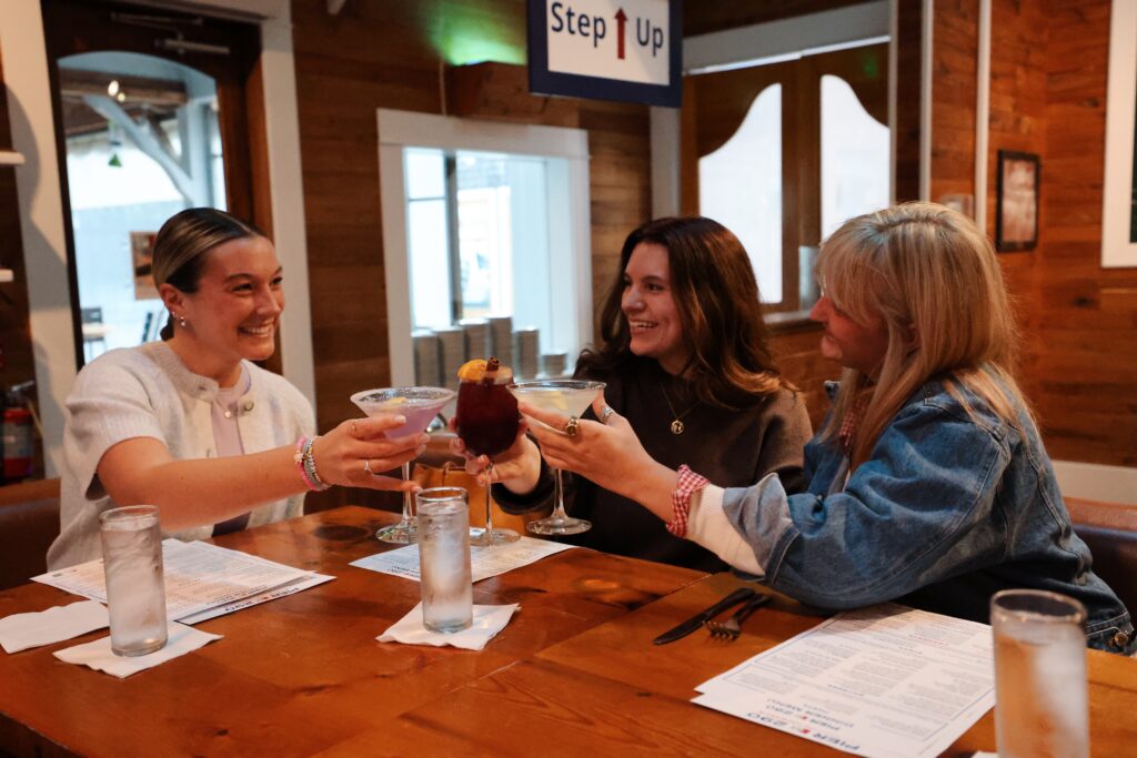 A photo of women drinking cocktails